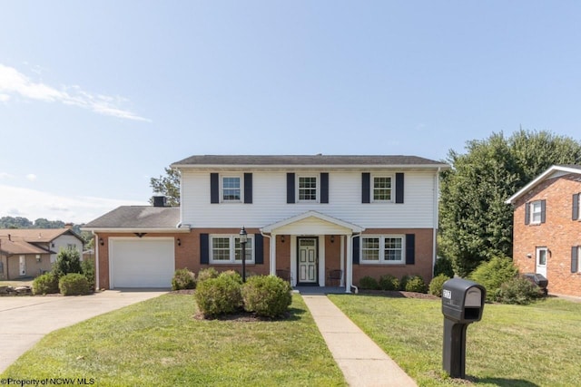 view of front of house with a garage and a front yard