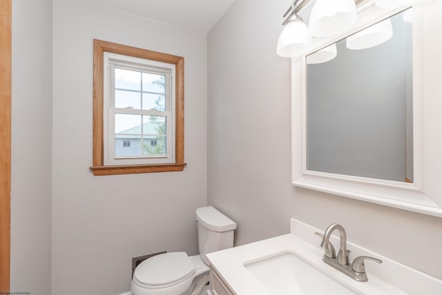 half bath with toilet and vanity