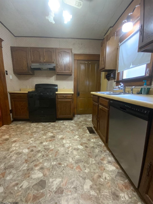 kitchen featuring sink, black range, and stainless steel dishwasher