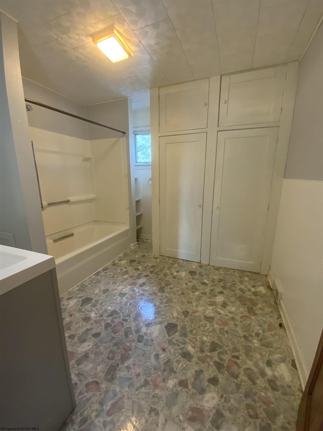 bathroom with vanity and bathing tub / shower combination