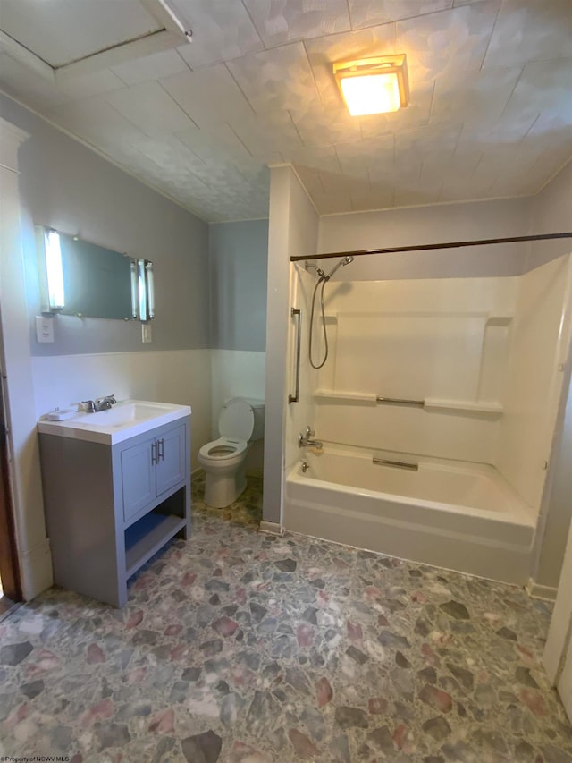 full bathroom with washtub / shower combination, vanity, and toilet