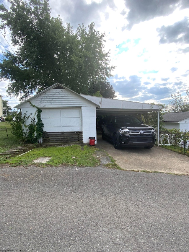 garage with a carport