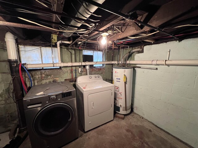 basement with washer and dryer and water heater