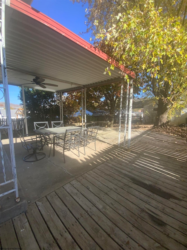 wooden deck featuring ceiling fan