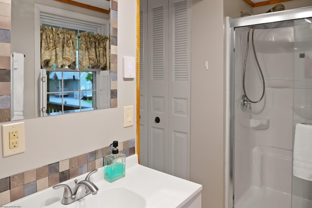 bathroom featuring vanity and a shower with shower door