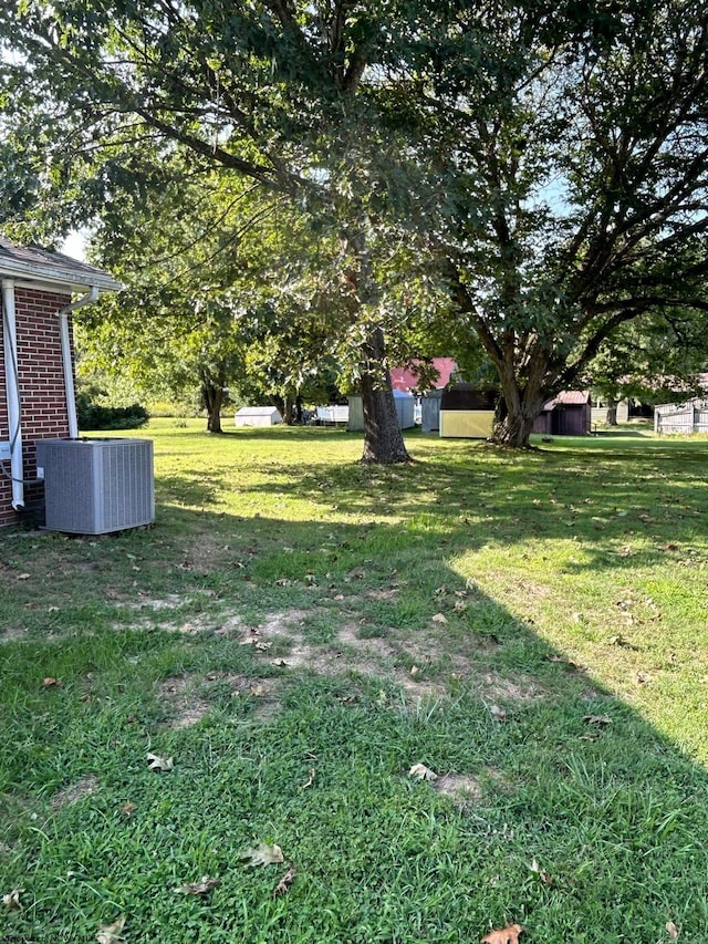 view of yard with central air condition unit