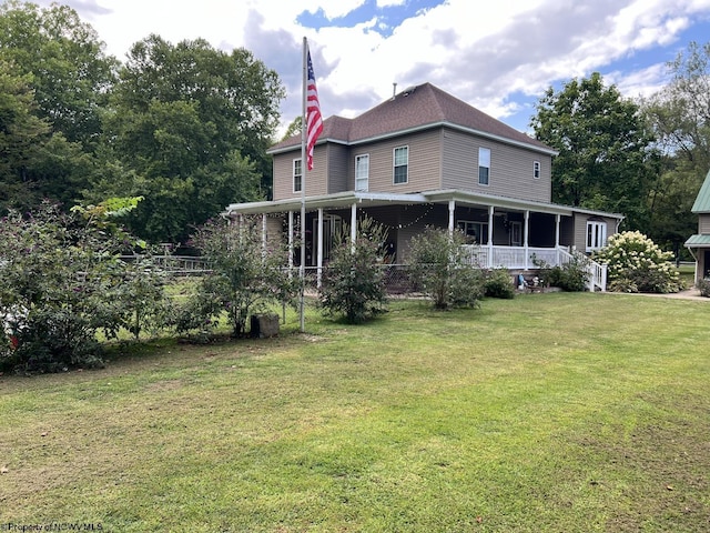 view of front of property with covered porch and a front lawn