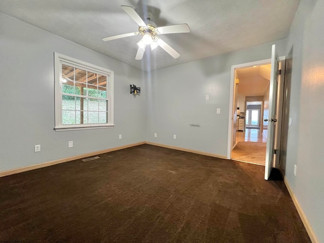 carpeted empty room with ceiling fan