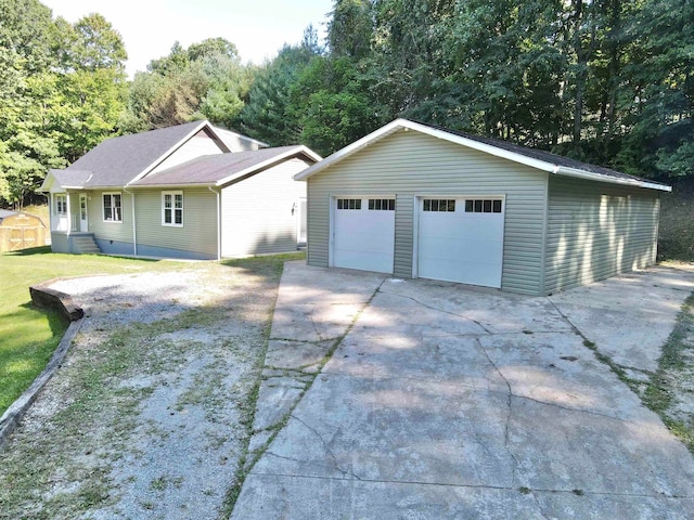 view of front facade with an outdoor structure and a garage