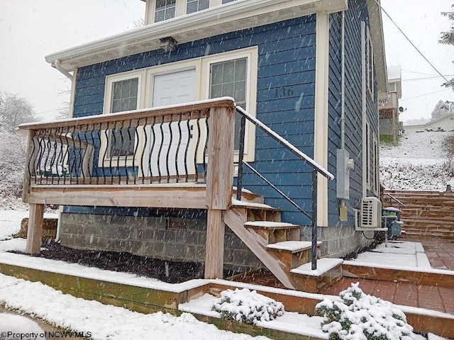 view of snow covered property entrance