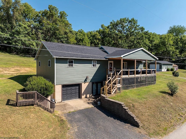 view of front of property featuring a garage and a front yard