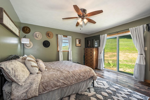 bedroom featuring a ceiling fan, access to outside, and dark wood-style flooring