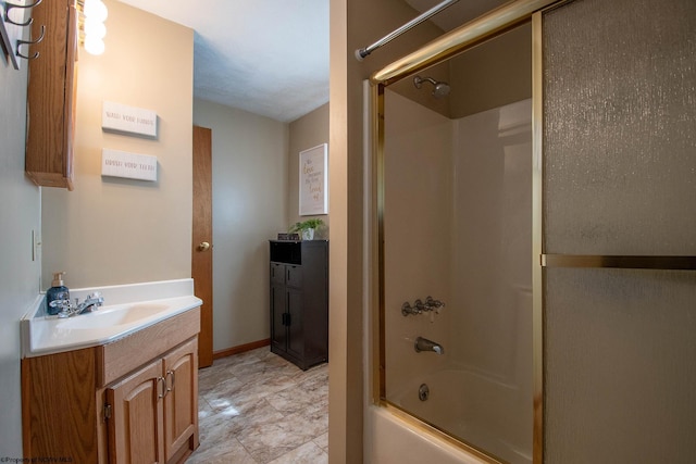 full bath featuring enclosed tub / shower combo, vanity, and baseboards