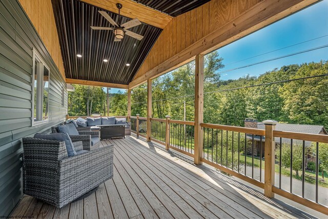 deck featuring an outdoor living space and ceiling fan