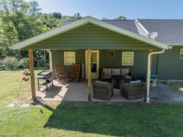 rear view of property with outdoor lounge area, a patio area, and a yard