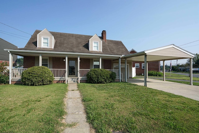 view of front of home featuring a front yard, a carport, and a porch