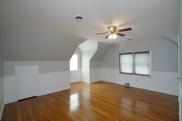 additional living space with vaulted ceiling, ceiling fan, and hardwood / wood-style flooring