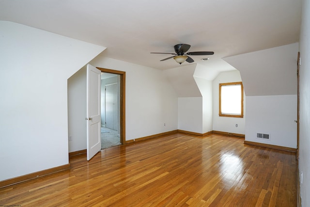 additional living space featuring lofted ceiling, ceiling fan, and light hardwood / wood-style floors