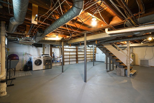 basement featuring independent washer and dryer and water heater