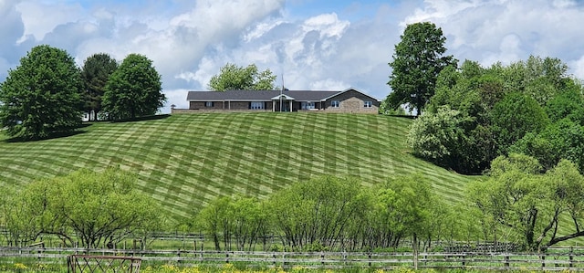 view of yard with a rural view