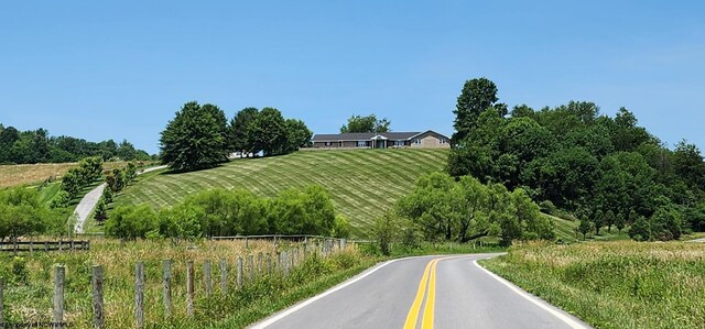 birds eye view of property with a rural view