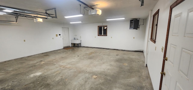 garage featuring a garage door opener and sink