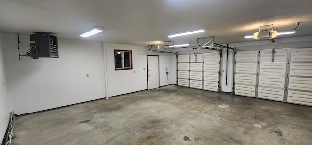 garage featuring a garage door opener and a baseboard heating unit