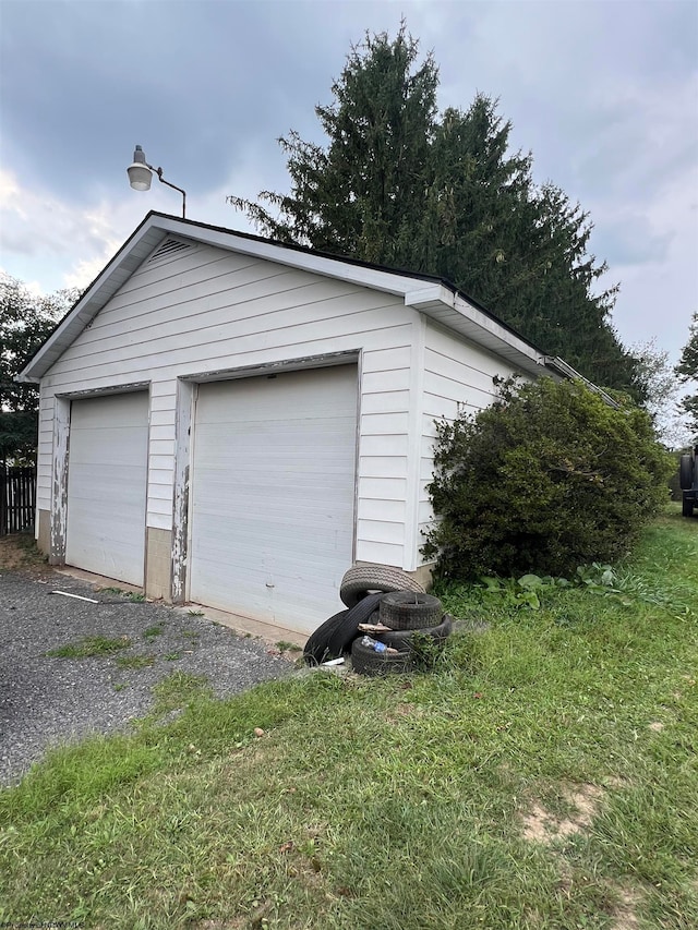 garage with a lawn