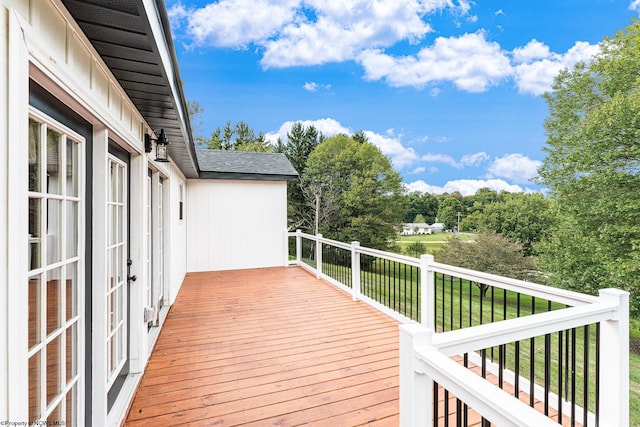 wooden terrace with a yard