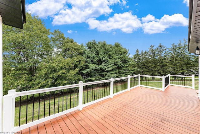 deck featuring a lawn