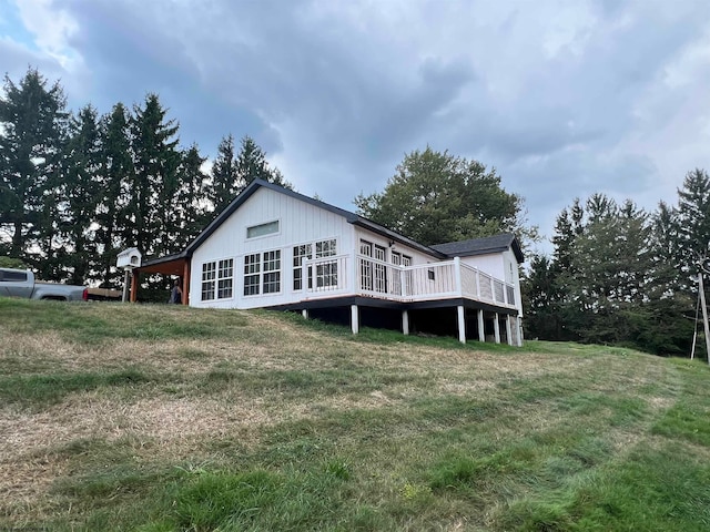 back of house with a lawn