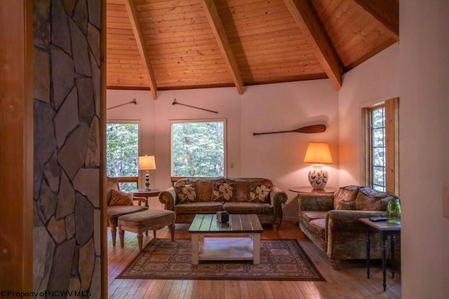 living room with wood ceiling, hardwood / wood-style floors, high vaulted ceiling, and beam ceiling