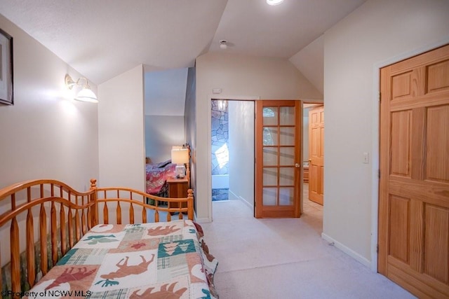 carpeted bedroom with vaulted ceiling