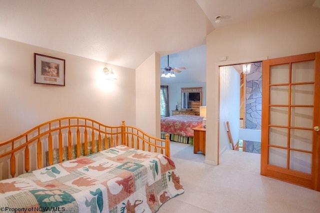 carpeted bedroom featuring lofted ceiling