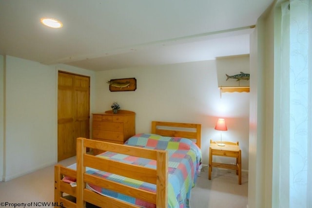 bedroom featuring a closet and carpet