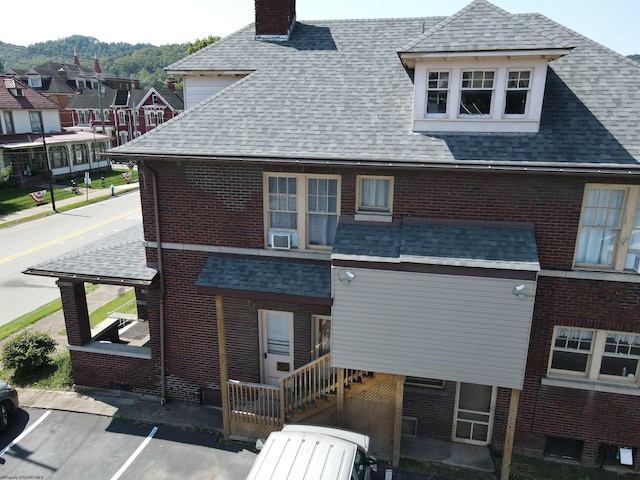 rear view of house with cooling unit