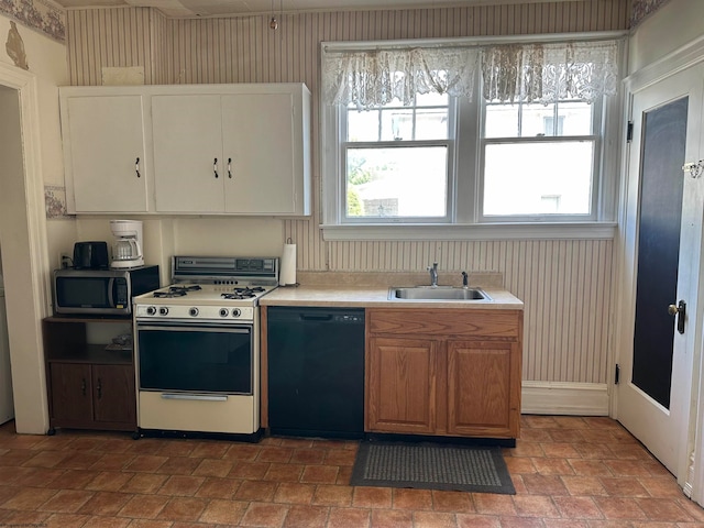 kitchen featuring dishwasher, gas range gas stove, and sink