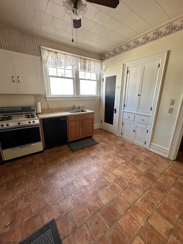 kitchen with dishwasher, range with gas cooktop, sink, white cabinetry, and ceiling fan