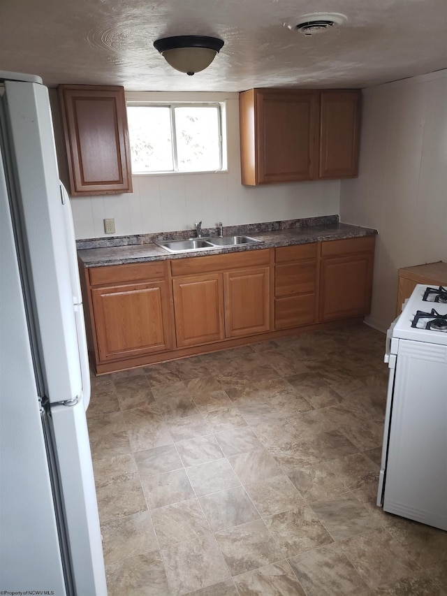 kitchen with white appliances and sink