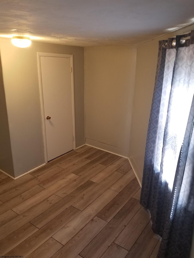 empty room featuring hardwood / wood-style flooring