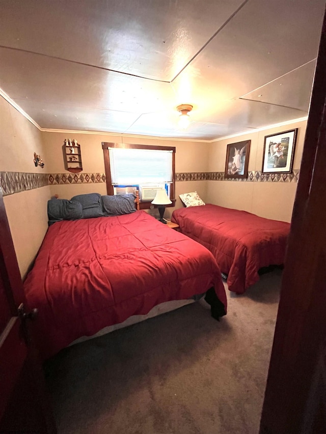 carpeted bedroom featuring crown molding