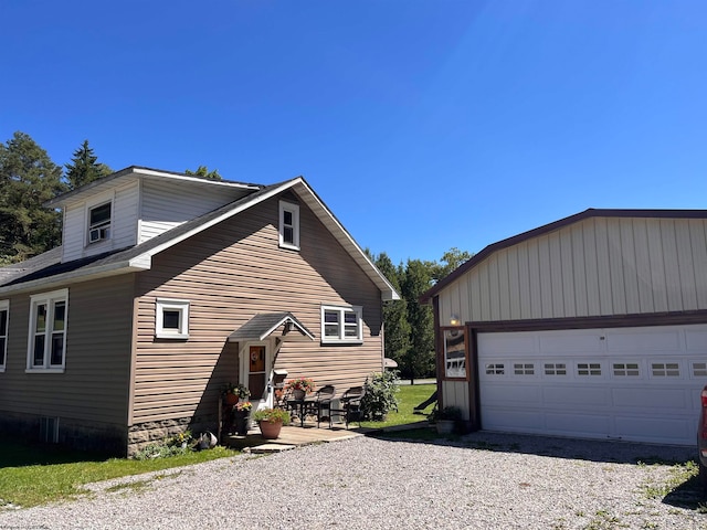 view of side of property with a garage