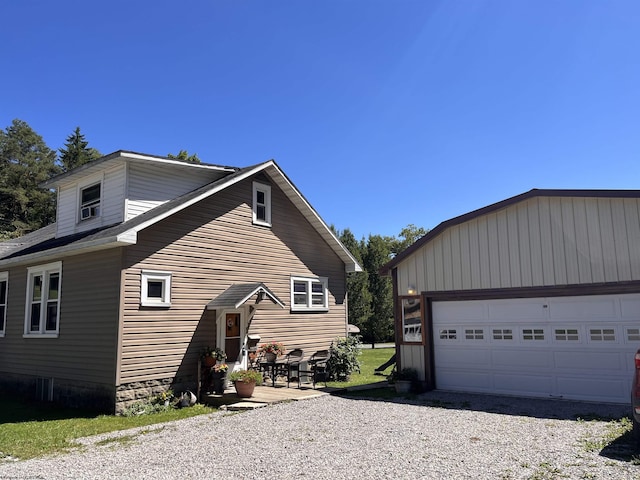 view of side of home featuring an outdoor structure