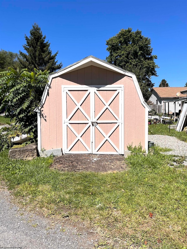 view of outdoor structure with a lawn