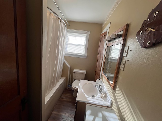 full bath with shower / bath combination with curtain, vanity, toilet, and wood finished floors