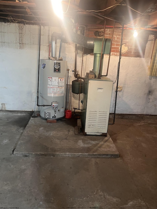 utility room featuring gas water heater