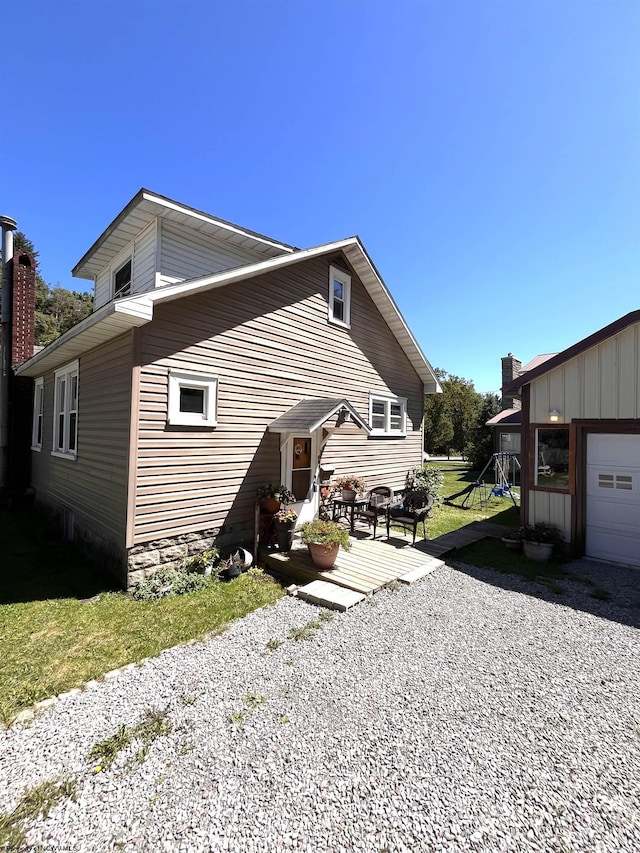 view of side of property with a garage