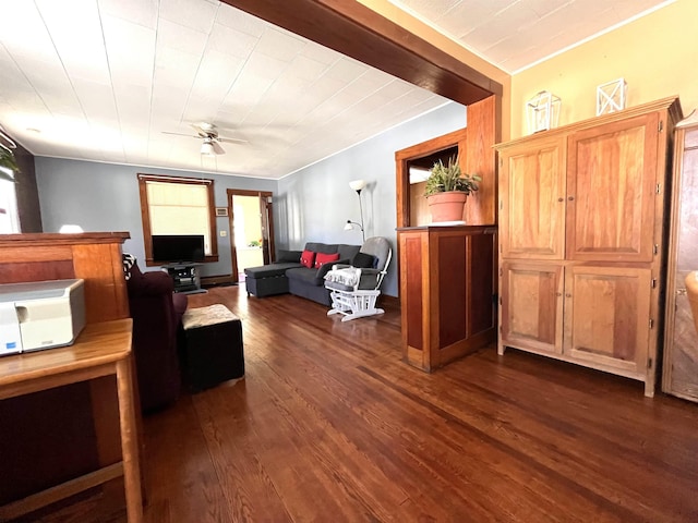 living room featuring dark wood-style floors and ceiling fan