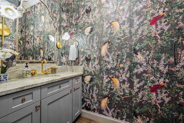 bathroom featuring vanity and wood-type flooring