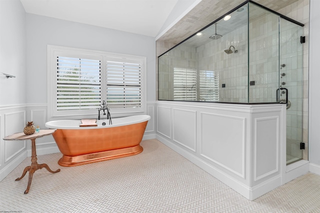 bathroom featuring tile patterned floors and plus walk in shower